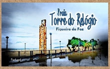 Load image into Gallery viewer, The Clock Tower, is an iconic symbol of Figueira da Foz. It was conceived in the late 40’s, as part of the seawall, and intended to accommodate sound booths for maritime signaling. In the era of the birth of re-inforced concrete, the authors chose to keep to tradition and built it as a steel carcass surrounded by stonemasonry. The Relógio Beach at its feet is the most famous beach in Figueira da Foz and is denominated “Princess of Beaches” with a width of sand of approximately 750 metres.